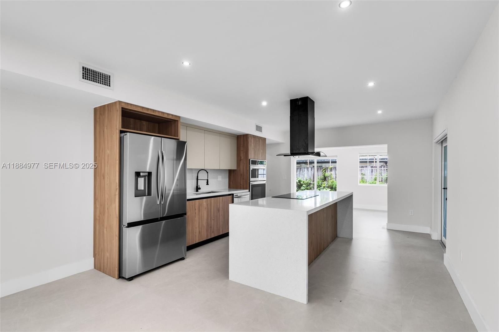 323 Northwest 104th Terrace Miami, FL 33150 - Photo 1 of 30 a kitchen with refrigerator and cabinets