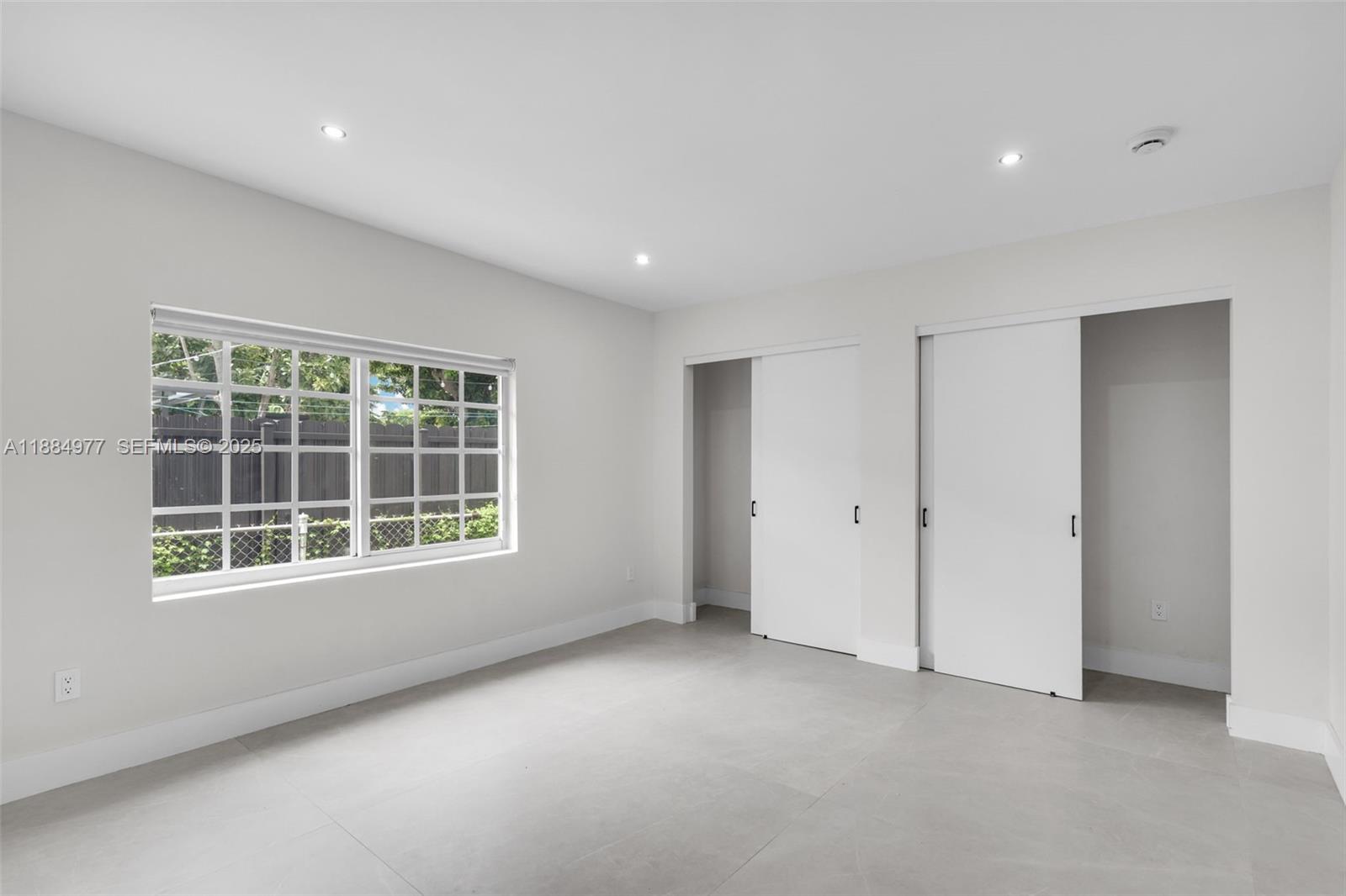 323 Northwest 104th Terrace Miami, FL 33150 - Photo 12 of 30 an empty room with a window