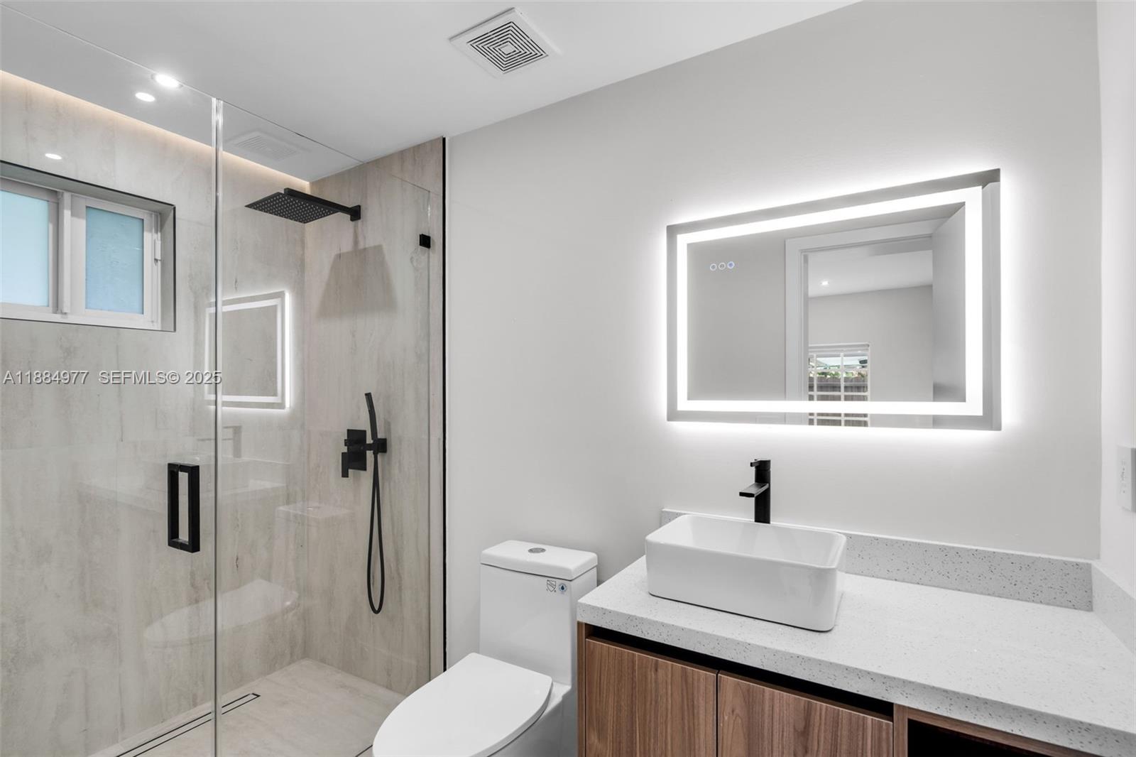 323 Northwest 104th Terrace Miami, FL 33150 - Photo 14 of 30 a bathroom with a sink toilet and shower