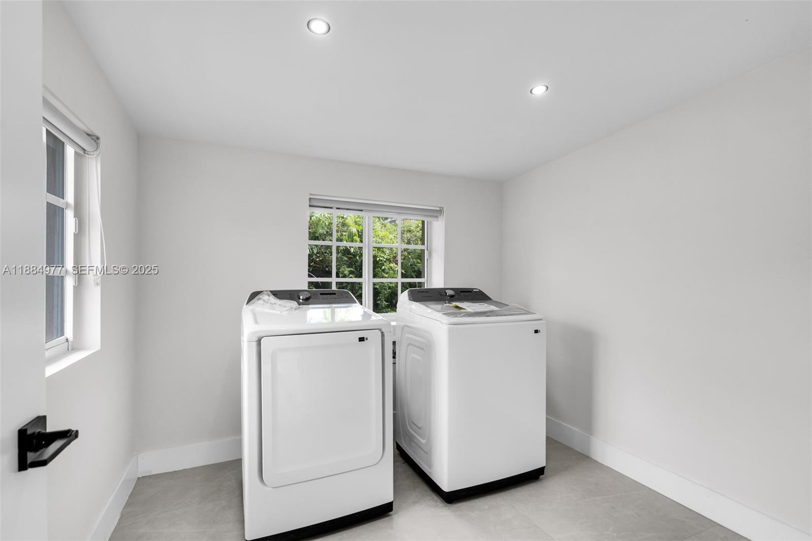323 Northwest 104th Terrace Miami, FL 33150 - Photo 17 of 30 a utility room with dryer and washer