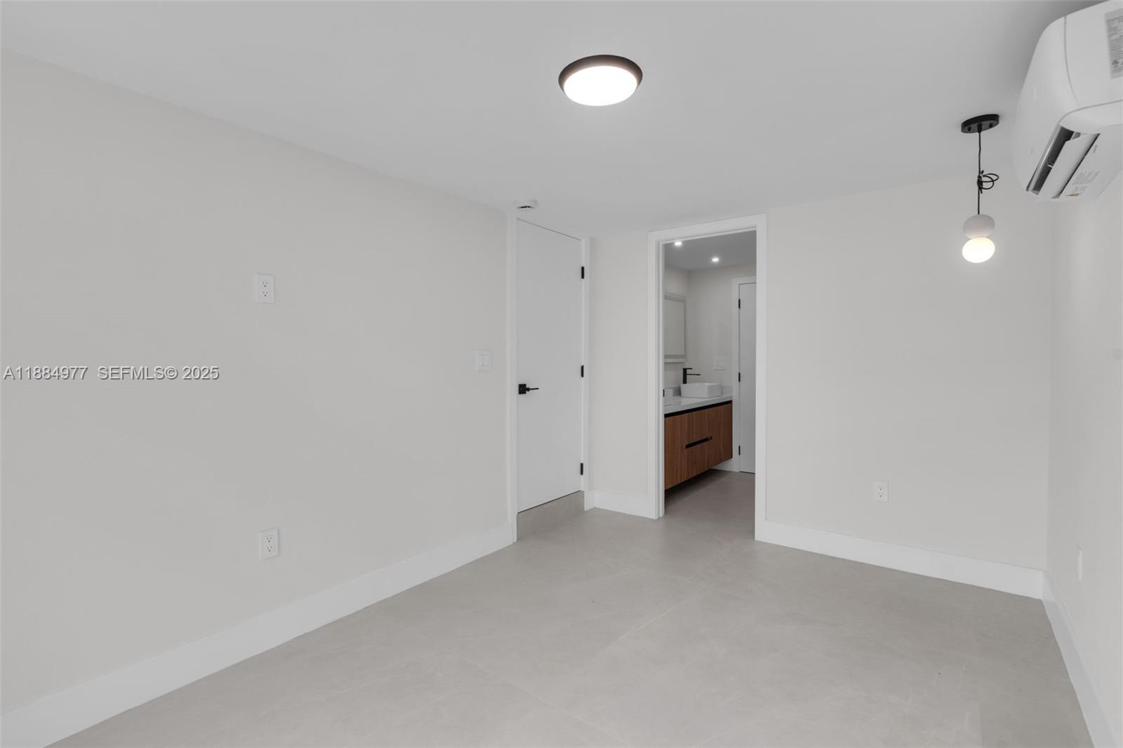 323 Northwest 104th Terrace Miami, FL 33150 - Photo 19 of 30 a view of an empty room with a window