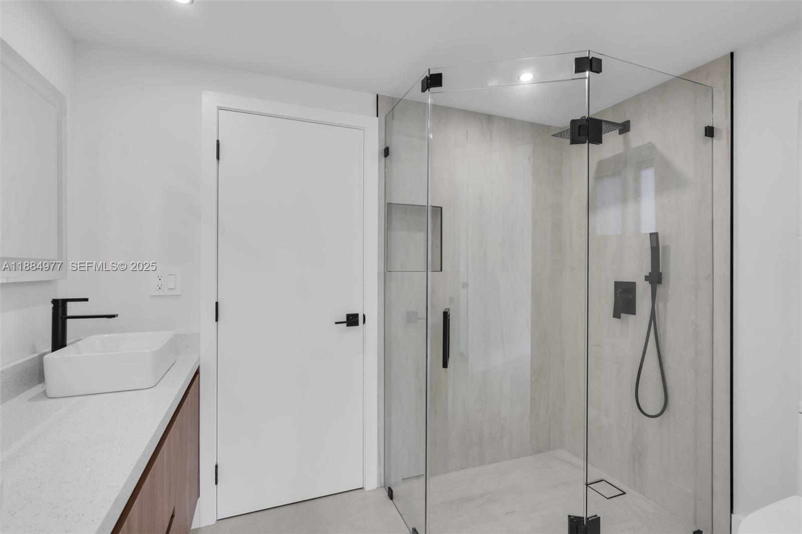 323 Northwest 104th Terrace Miami, FL 33150 - Photo 21 of 30 a bathroom with a shower sink vanity and mirror