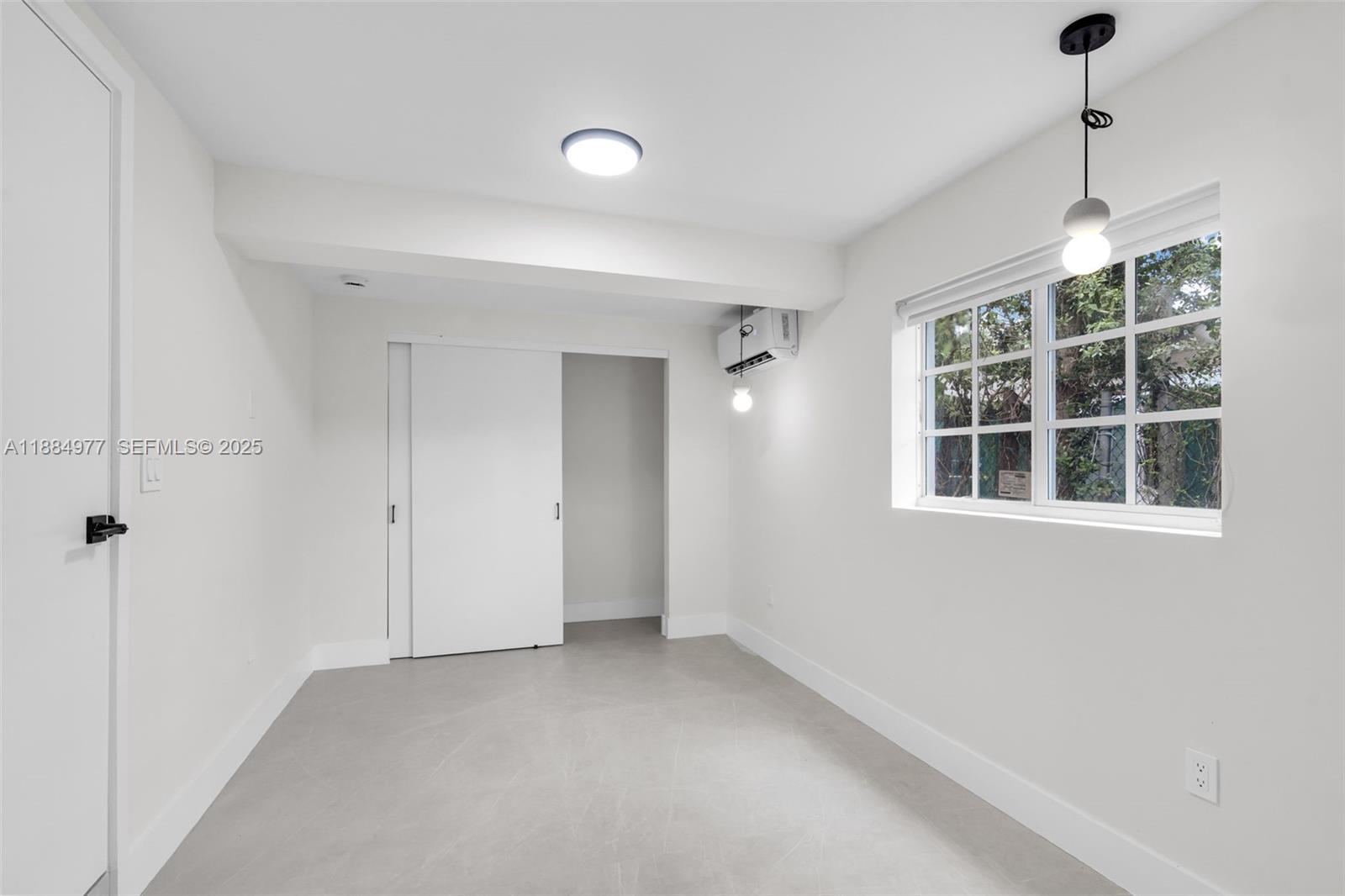 323 Northwest 104th Terrace Miami, FL 33150 - Photo 22 of 30 a view of empty room with windows