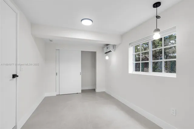 a view of empty room with windows