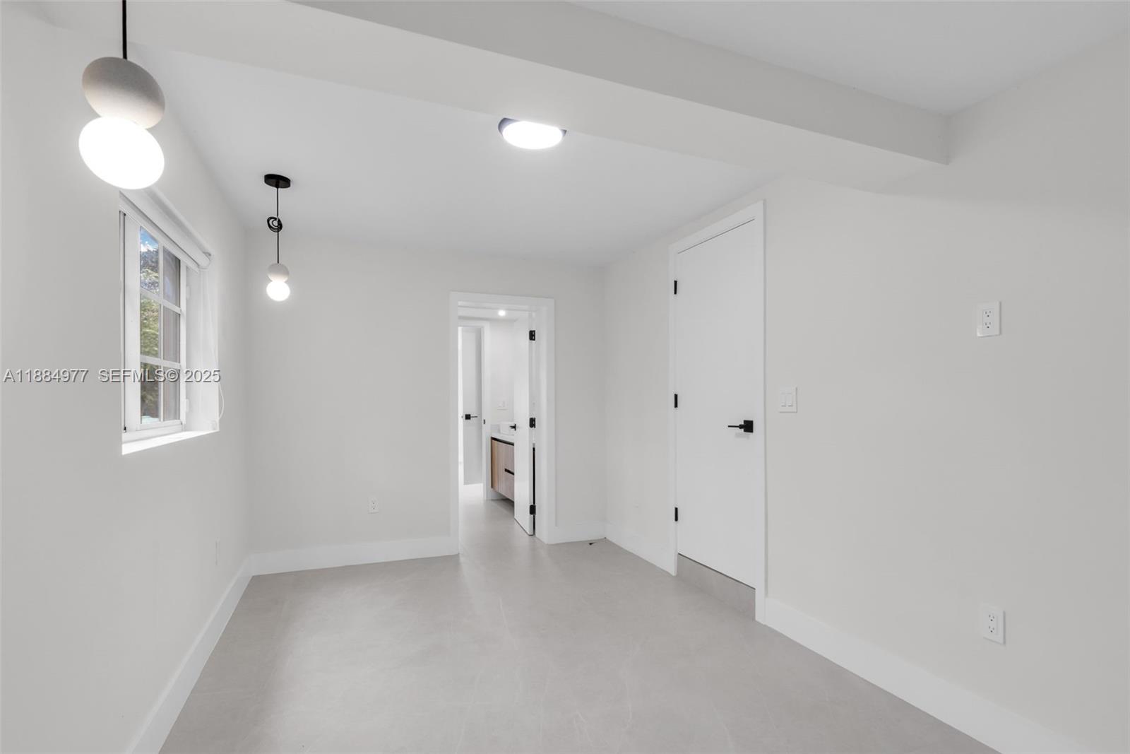 323 Northwest 104th Terrace Miami, FL 33150 - Photo 23 of 30 a view of an empty room with a window