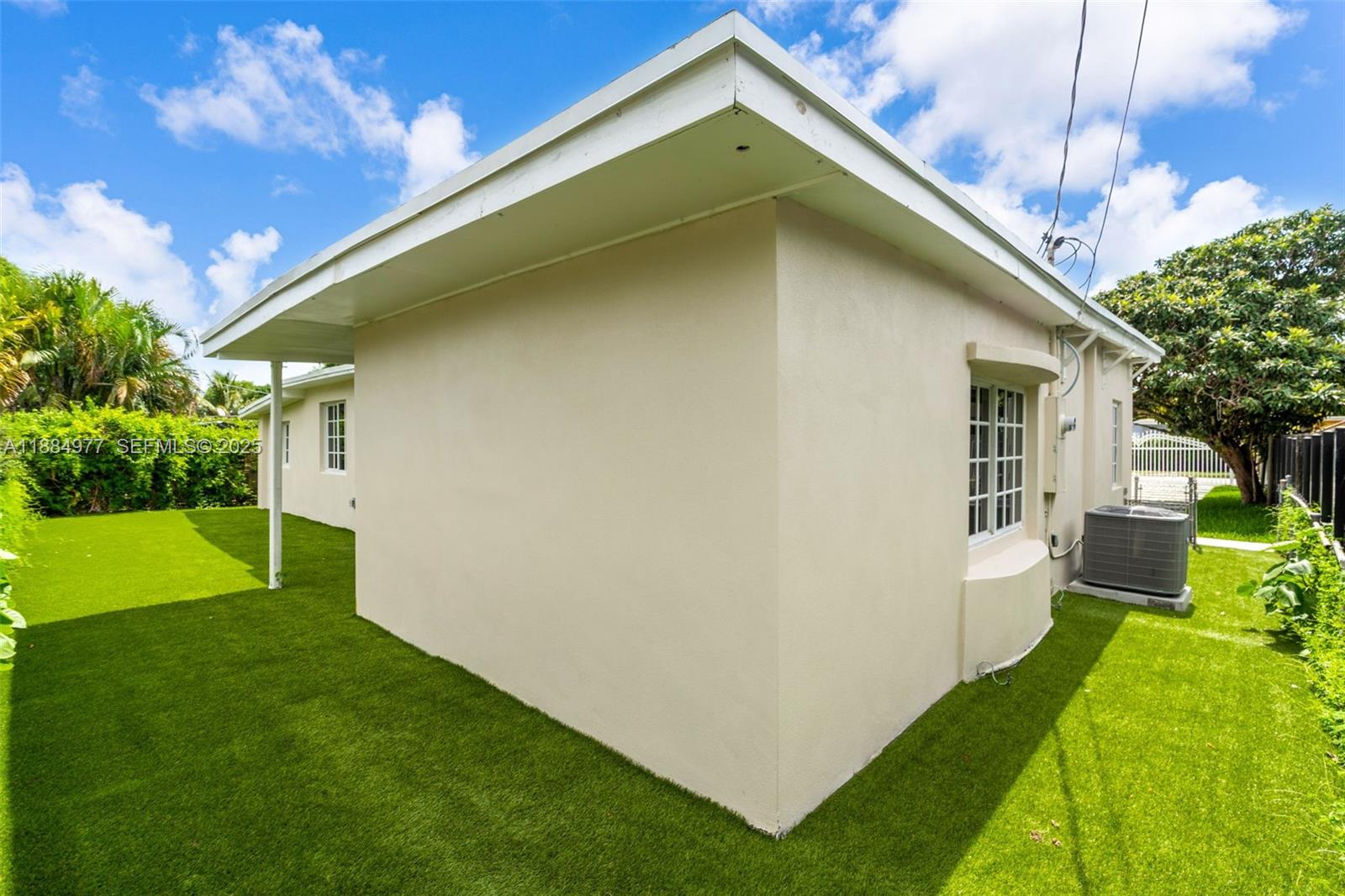 323 Northwest 104th Terrace Miami, FL 33150 - Photo 25 of 30 a house view with a garden space