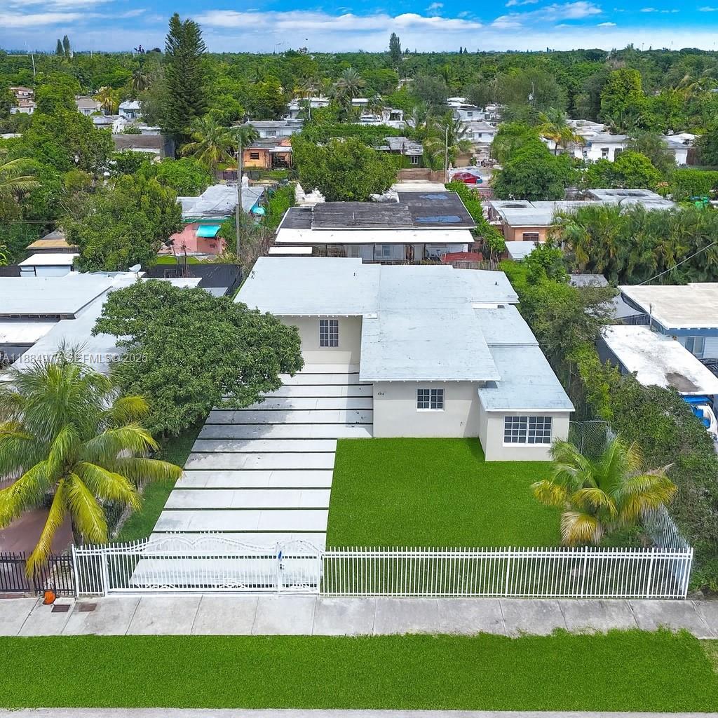 323 Northwest 104th Terrace Miami, FL 33150 - Photo 28 of 30 a view of a house with a yard