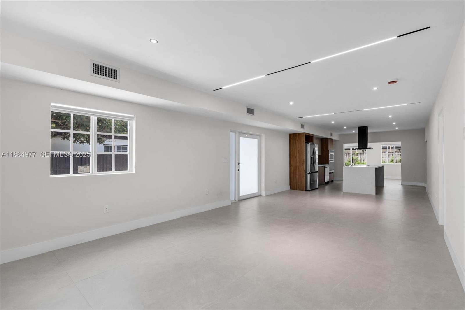 323 Northwest 104th Terrace Miami, FL 33150 - Photo 4 of 30 a view of an empty room with a window