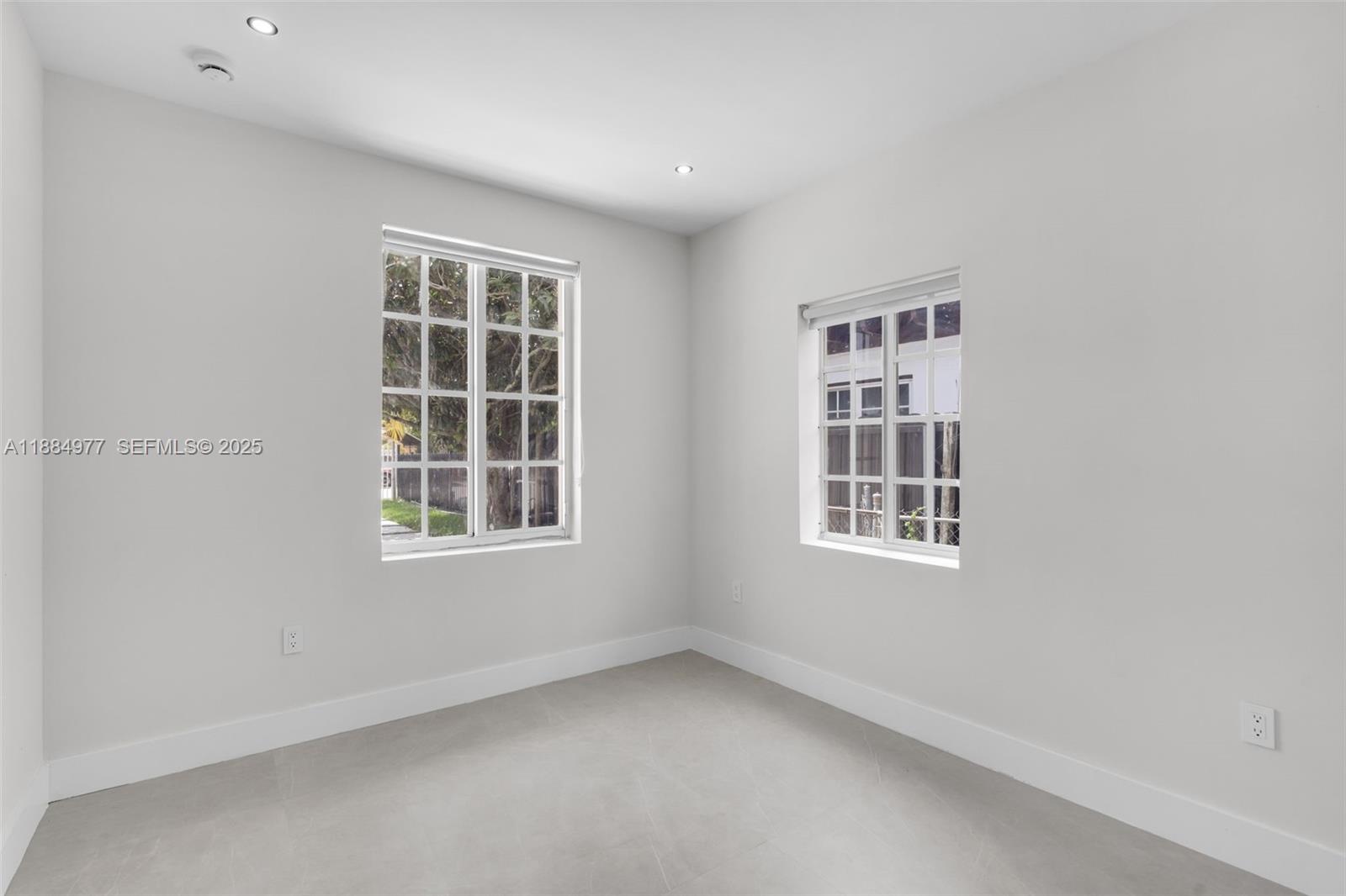 323 Northwest 104th Terrace Miami, FL 33150 - Photo 10 of 30 an empty room with a window