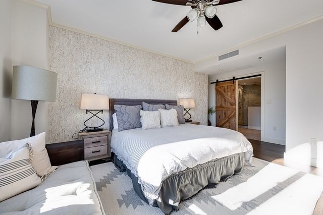 a bedroom with a bed and window