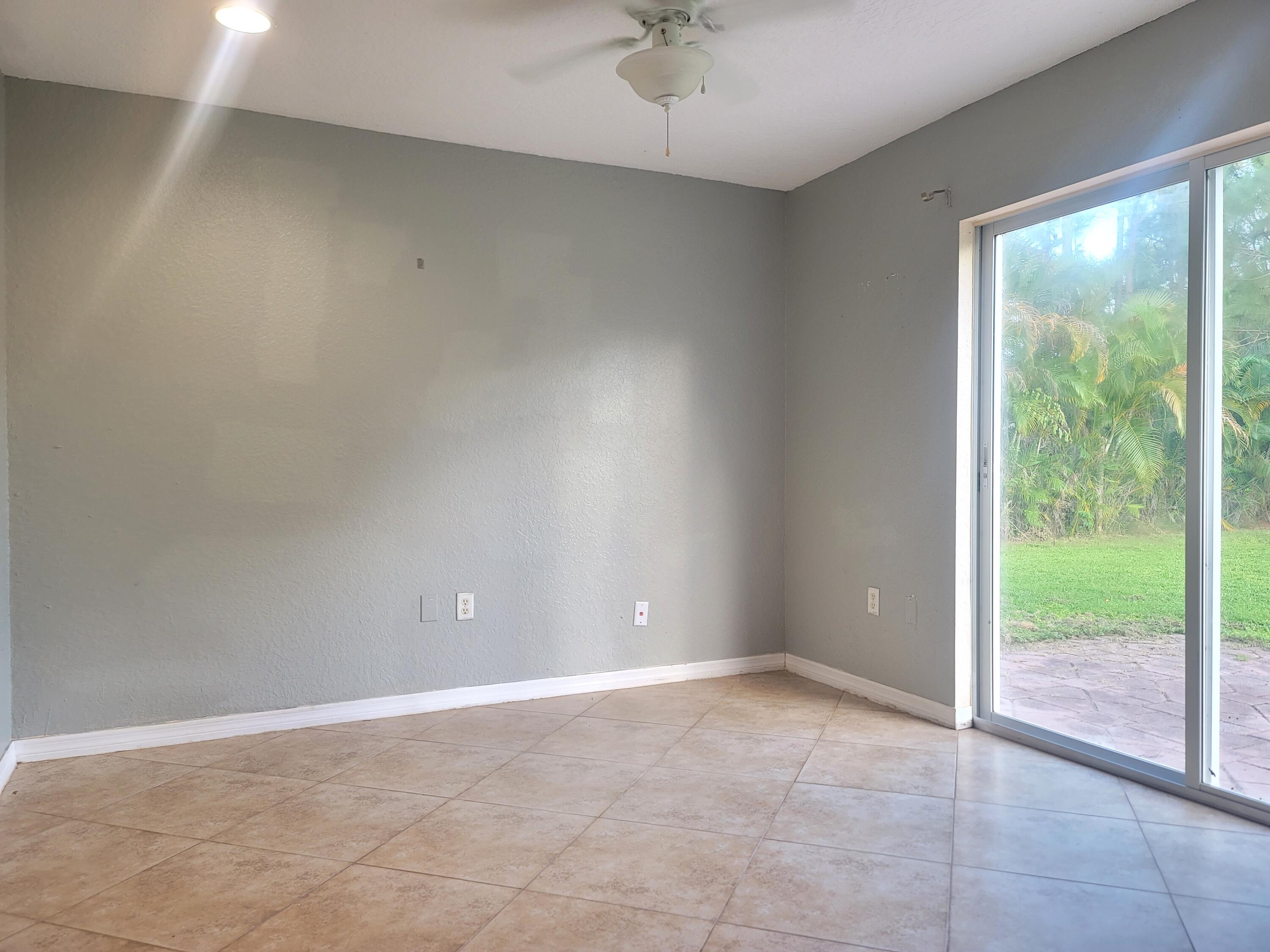 15664 N Road, Unit A Loxahatchee Groves, FL 33470 - Photo 14 of 16 a view of an empty room with a window