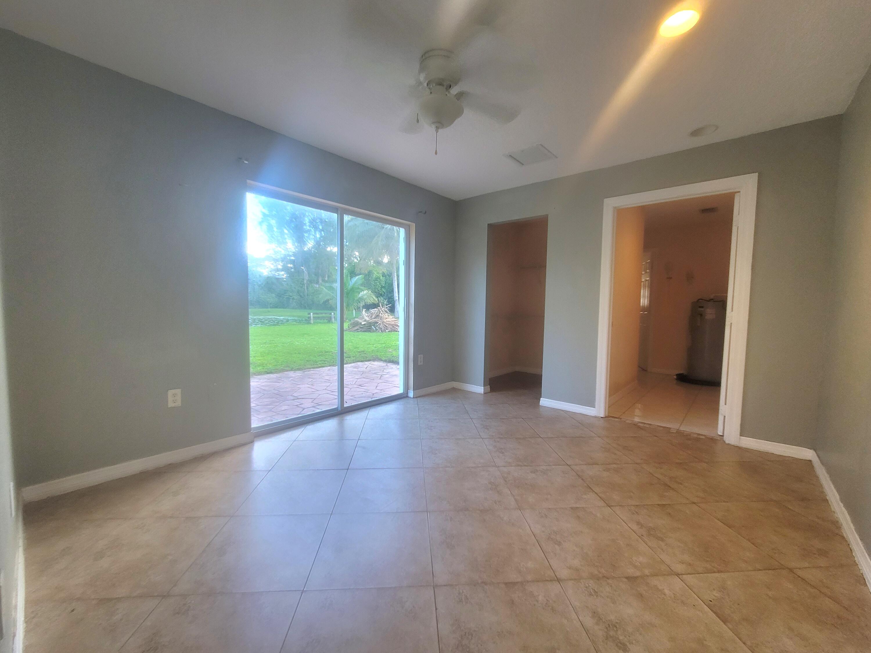 15664 N Road, Unit A Loxahatchee Groves, FL 33470 - Photo 15 of 16 a view of an empty room with a window