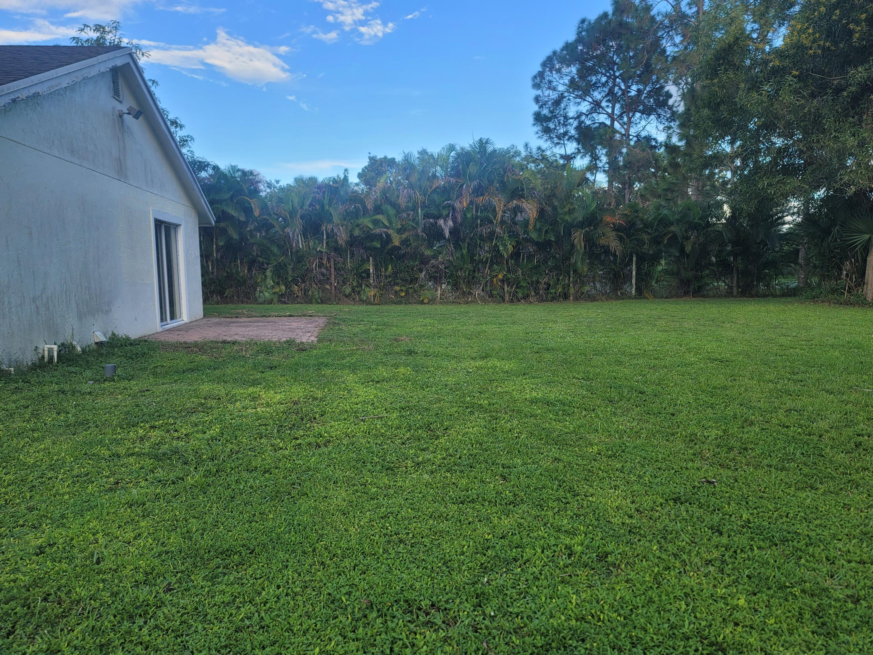 15664 N Road, Unit A Loxahatchee Groves, FL 33470 - Photo 4 of 16 a view of an outdoor space and a yard