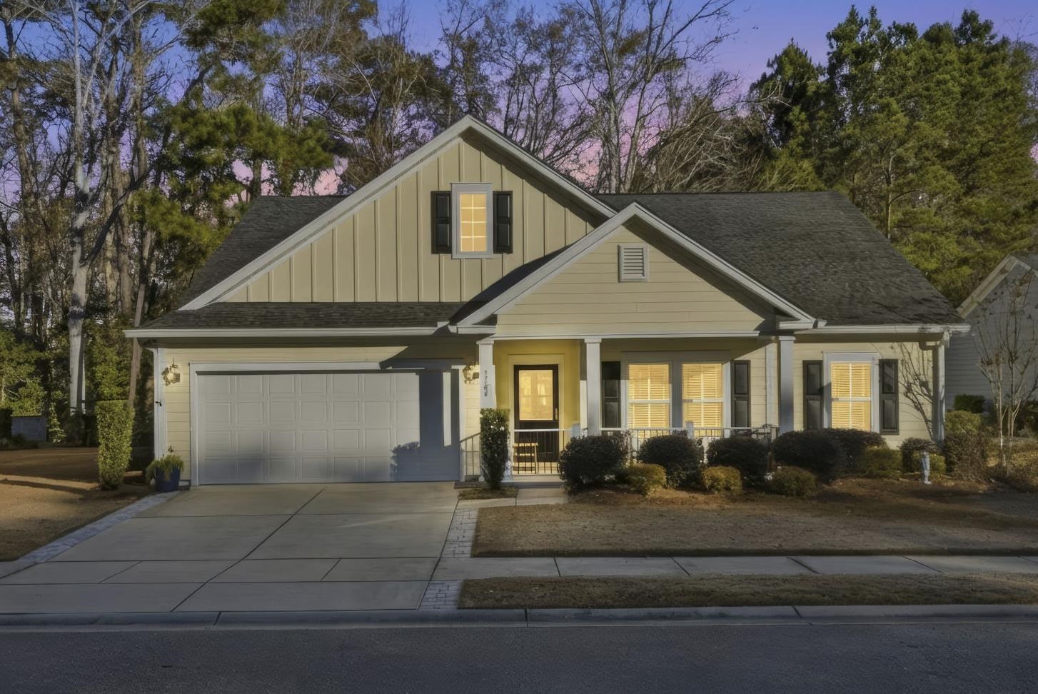1704 Edgewood Drive Myrtle Beach, SC 29577 - Photo 1 of 40 View of front of house with board and batten siding, a porch, driveway, roof with shingles, and a garage