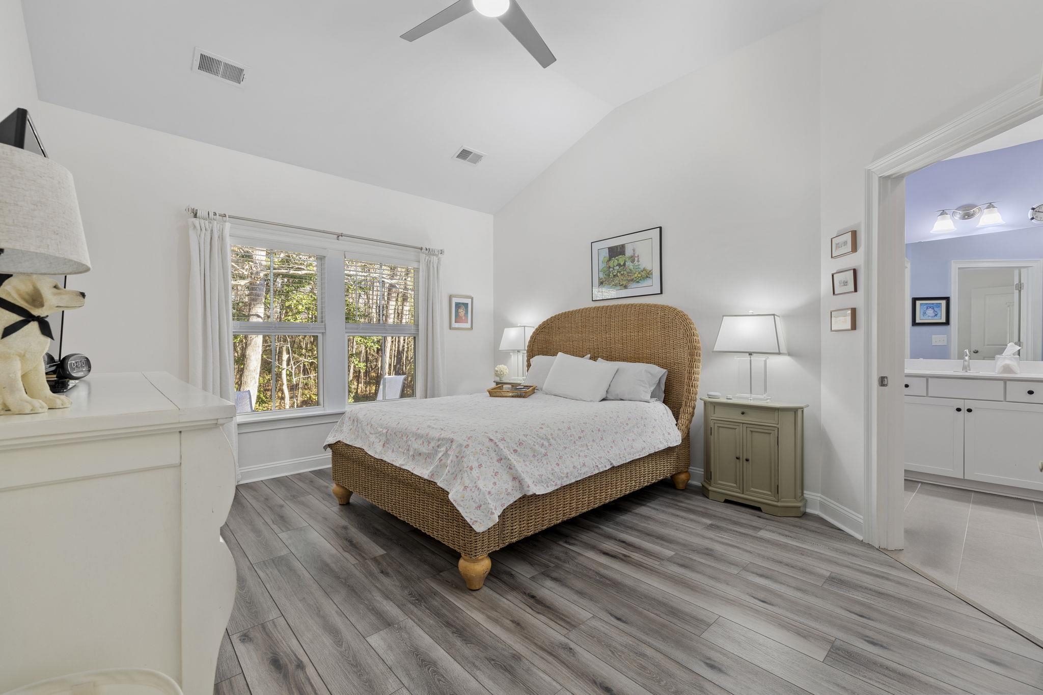 1704 Edgewood Drive Myrtle Beach, SC 29577 - Photo 15 of 40 Bedroom featuring vaulted ceiling, light wood-style floors, a ceiling fan, and ensuite bath