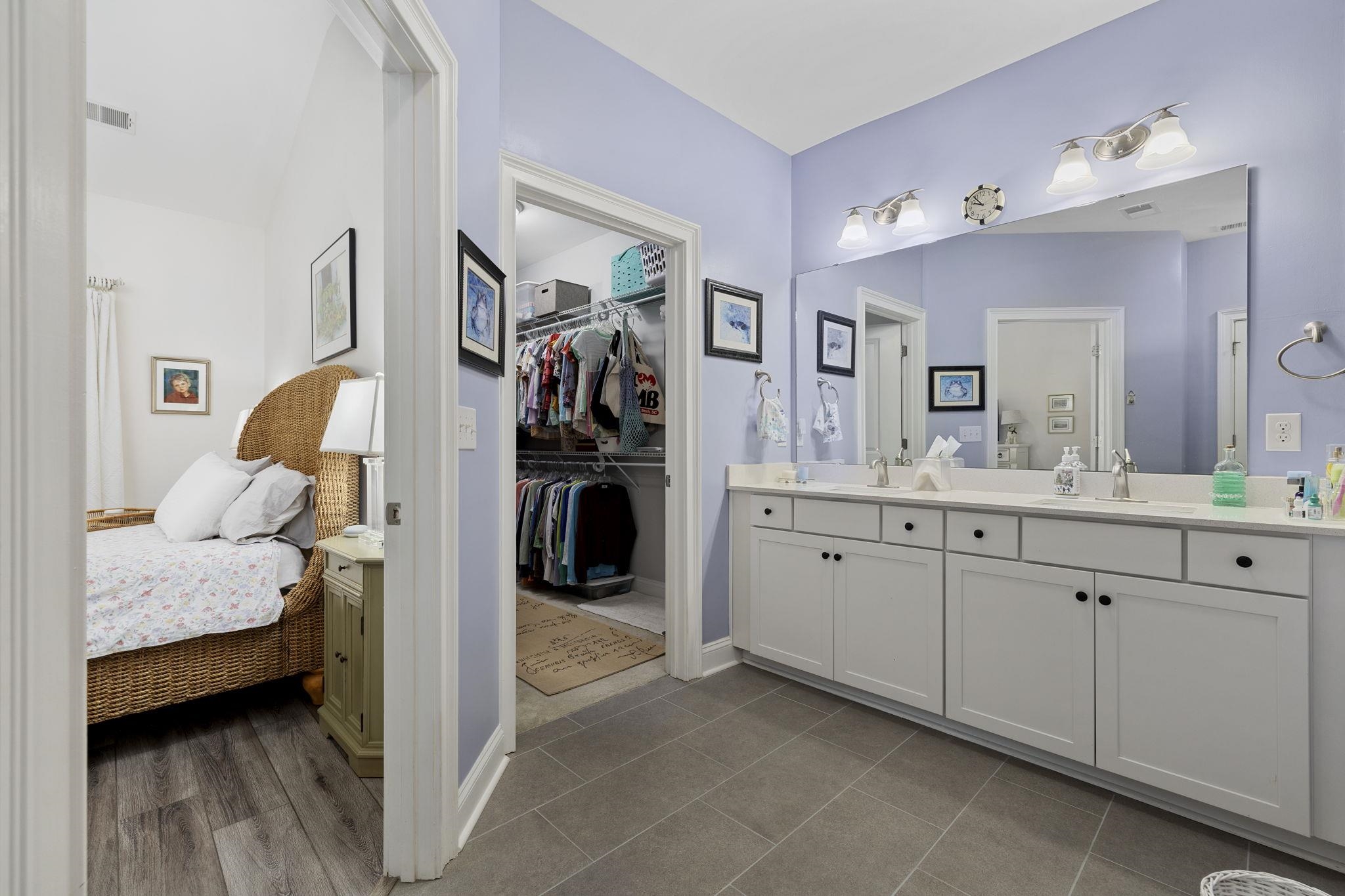 1704 Edgewood Drive Myrtle Beach, SC 29577 - Photo 18 of 40 Ensuite bathroom featuring double vanity, light tile patterned floors, and a walk in closet