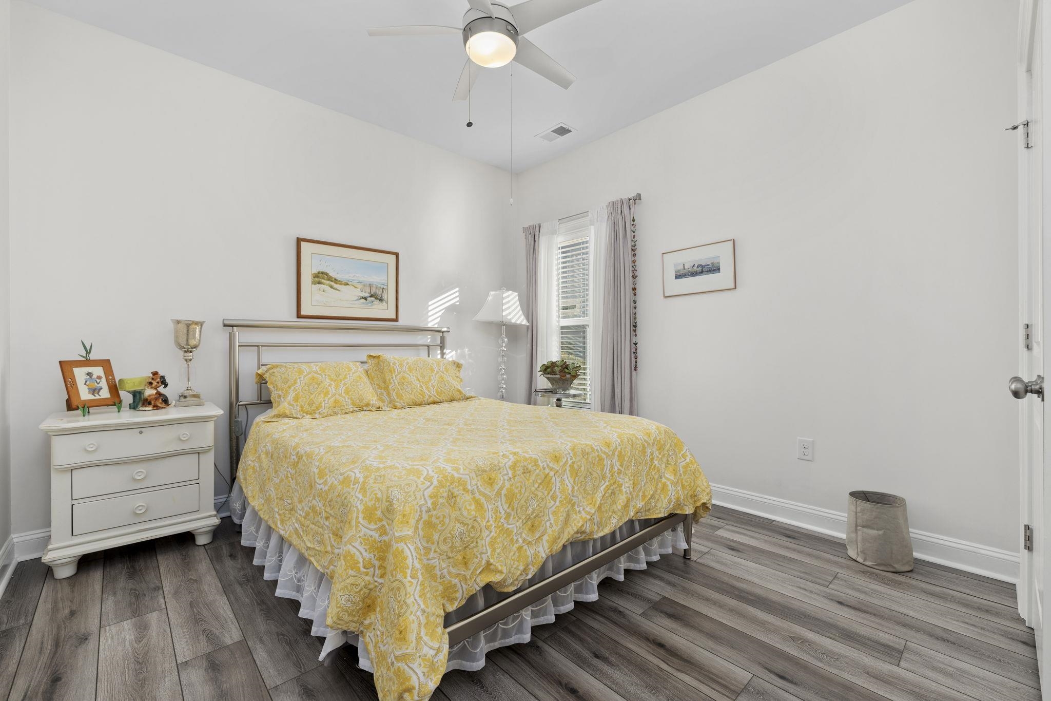 1704 Edgewood Drive Myrtle Beach, SC 29577 - Photo 22 of 40 Bedroom with ceiling fan and dark wood-style floors