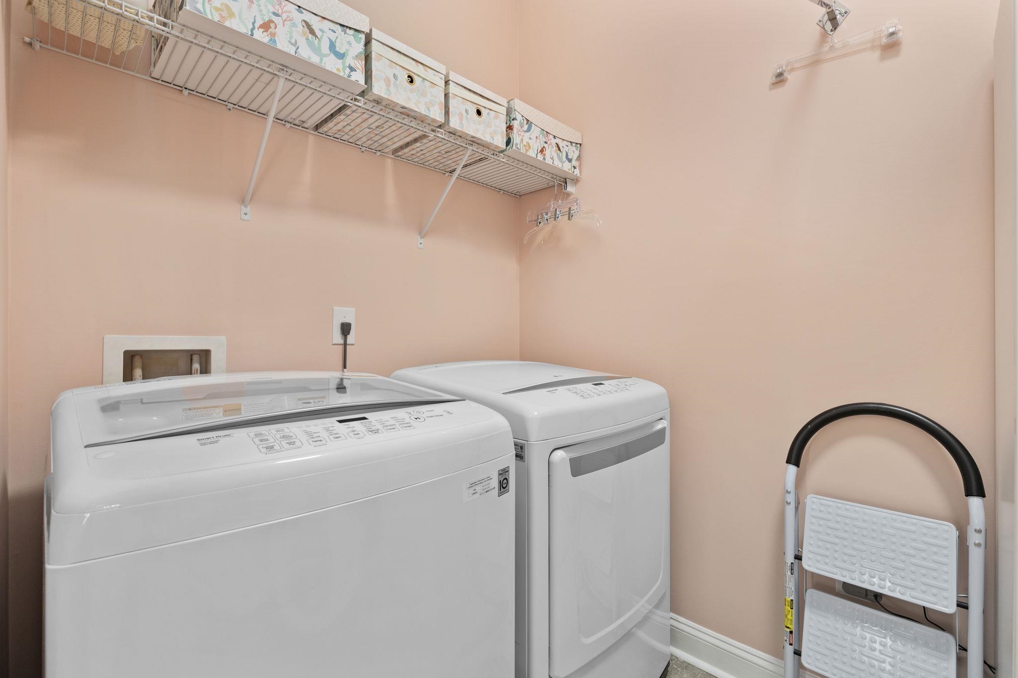 1704 Edgewood Drive Myrtle Beach, SC 29577 - Photo 26 of 40 Laundry room featuring washer and clothes dryer and baseboards