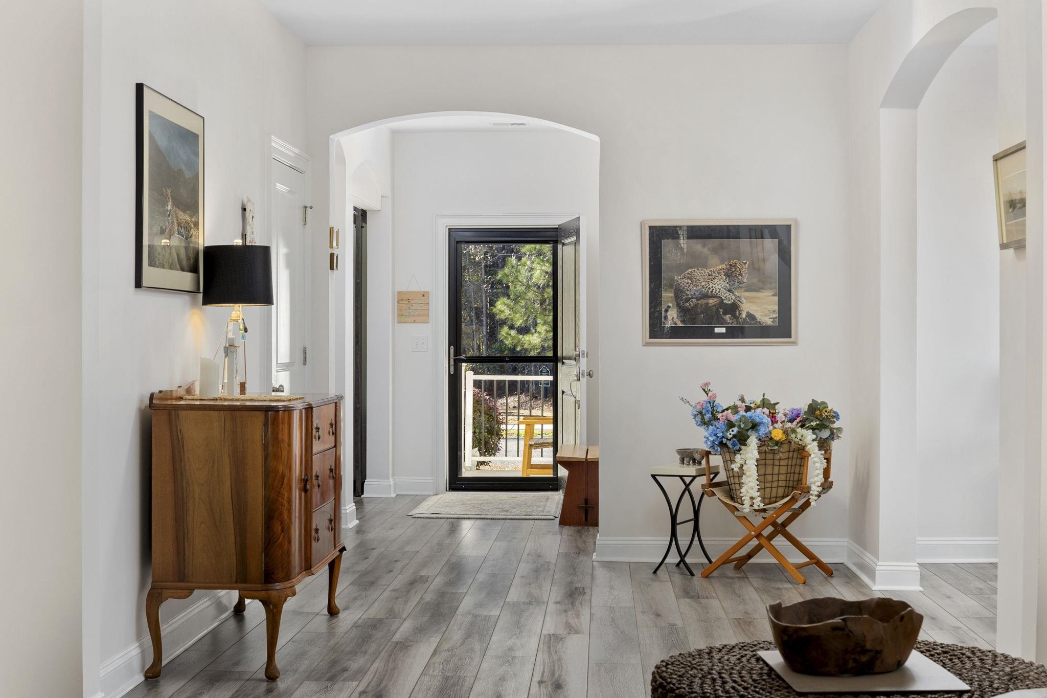 1704 Edgewood Drive Myrtle Beach, SC 29577 - Photo 4 of 40 Entrance foyer with arched walkways and light wood-style flooring