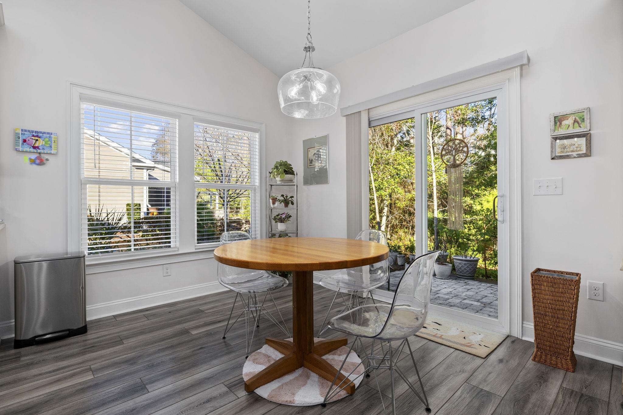 1704 Edgewood Drive Myrtle Beach, SC 29577 - Photo 10 of 40 Dining area with lofted ceiling and dark wood-type flooring