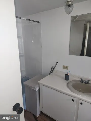a bathroom with a sink and mirror