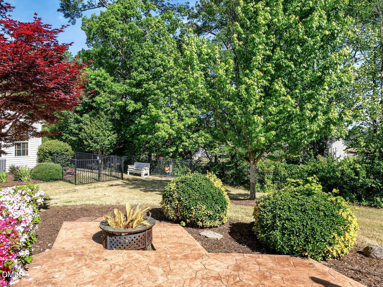 8215 Yaxley Hall Drive Raleigh, NC 27616 - Photo 30 of 42 a view of a backyard with plants