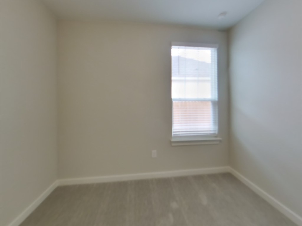 609 Foxtail Agave Street Leander, TX 78641 - Photo 11 of 29 an empty room with a window