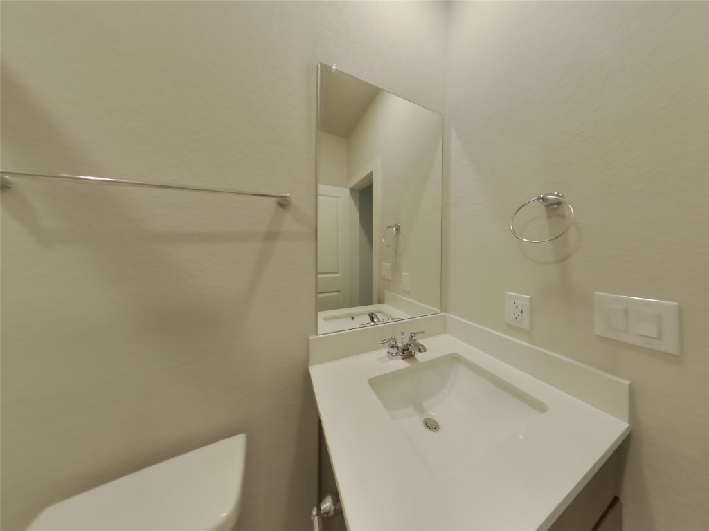 609 Foxtail Agave Street Leander, TX 78641 - Photo 14 of 29 a bathroom with a sink a toilet and shower