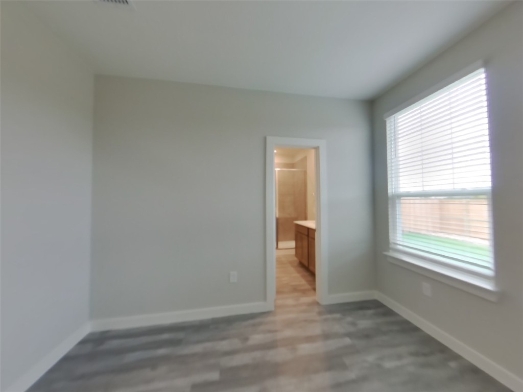 609 Foxtail Agave Street Leander, TX 78641 - Photo 6 of 29 an empty room with a window