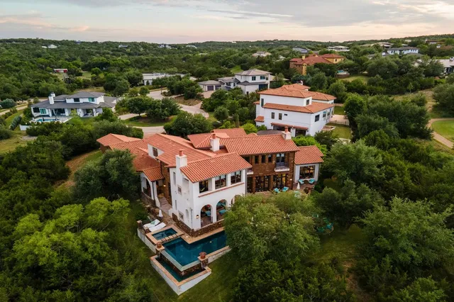 an aerial view of a house with a garden