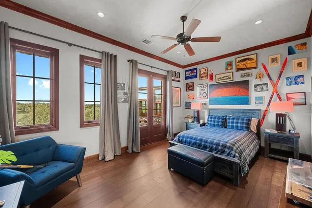 a bedroom with a bed couch and a window