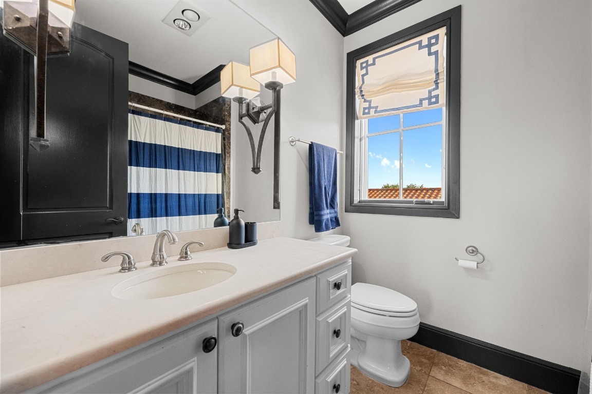 12724 Little Blue Austin, TX 78738 - Photo 35 of 40 a bathroom with a sink toilet and shower