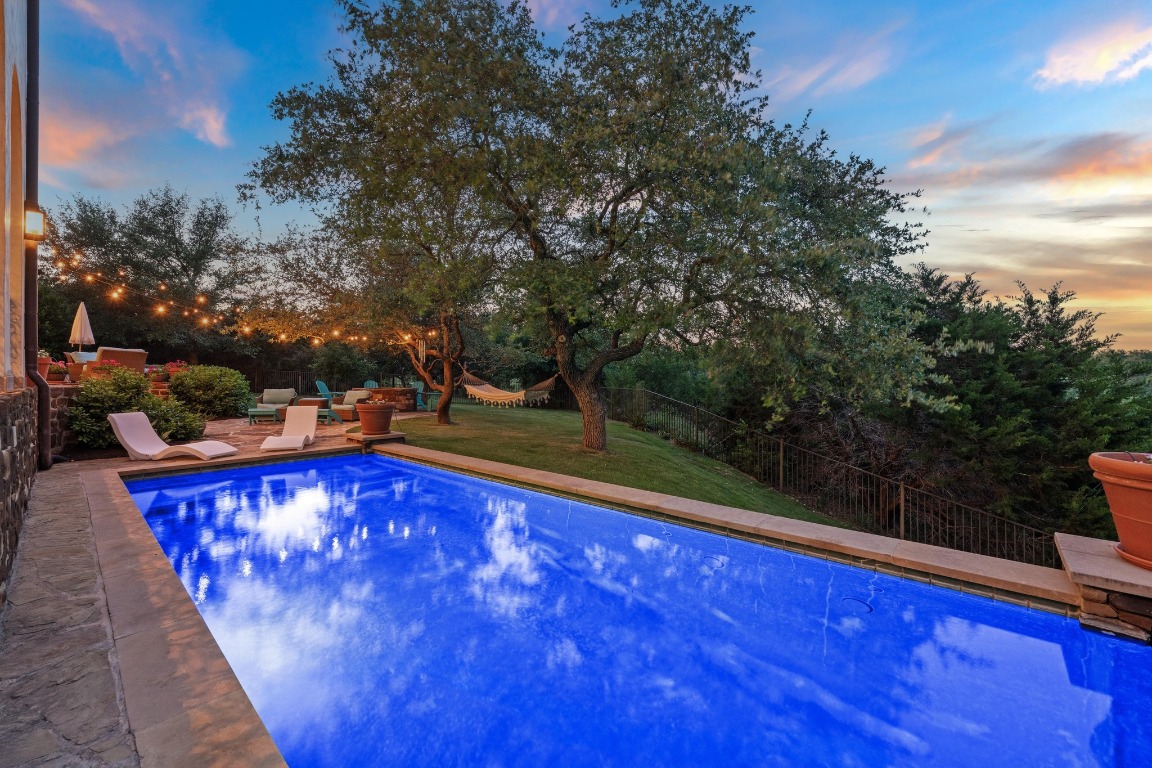 12724 Little Blue Austin, TX 78738 - Photo 38 of 40 a view of swimming pool with outdoor seating and plants