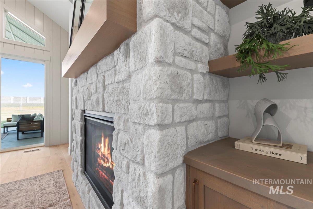 9580 South Prairie Falcon Avenue Nampa, ID 83686 - Photo 12 of 50 Detailed view of a fireplace and wood finished floors