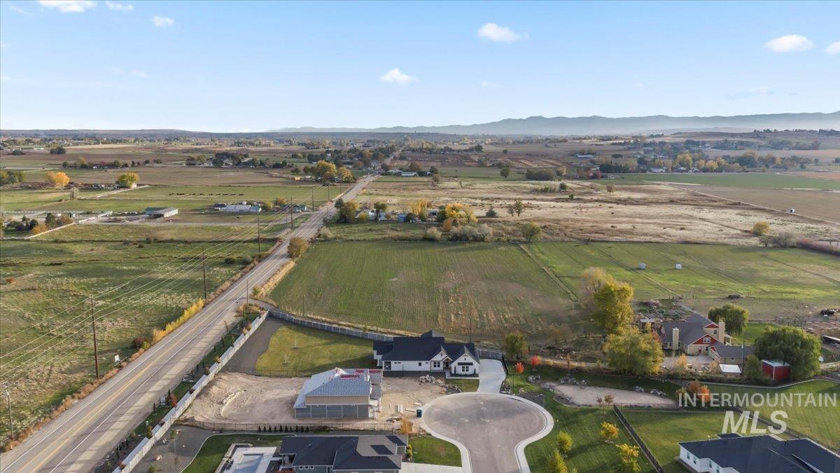 9580 South Prairie Falcon Avenue Nampa, ID 83686 - Photo 49 of 50 Aerial view of property's location with rural landscape and a mountain backdrop