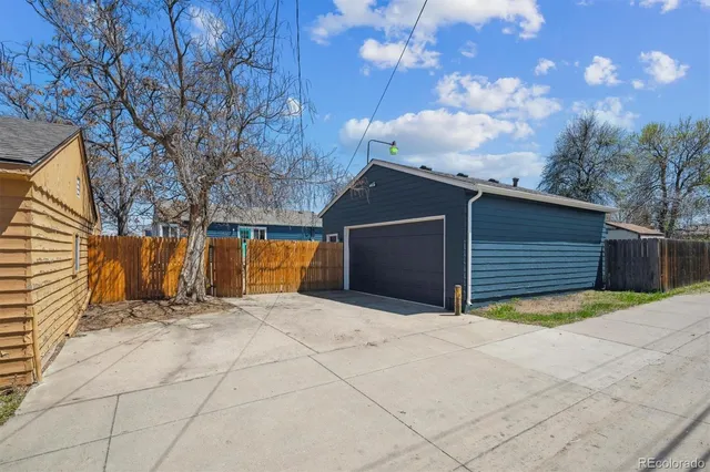 a view of basketball place with a garage
