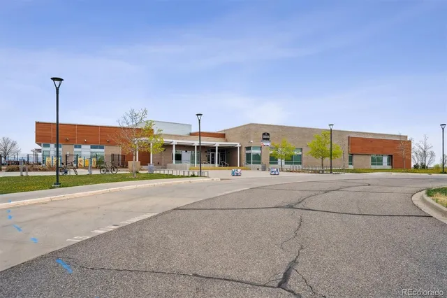 a view of a city street with tall buildings