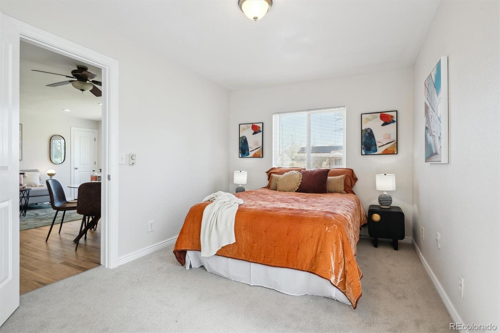 2285 Fulton Street Aurora, CO 80010 - Photo 6 of 22 a bed room with a bed and a chair