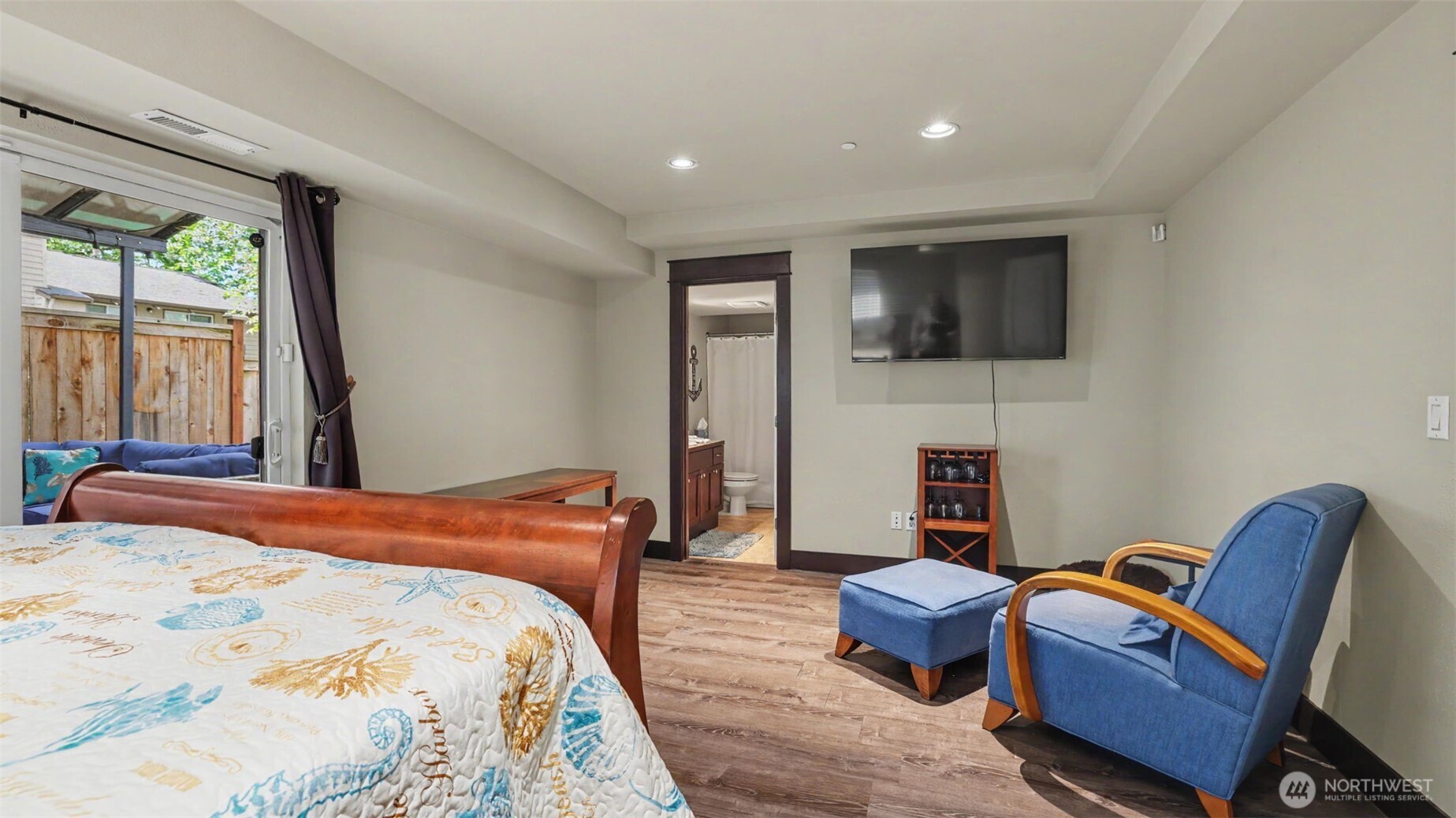 1357 Elma Place Northeast Renton, WA 98059 - Photo 35 of 40 a bedroom with furniture a flat screen tv and a fireplace