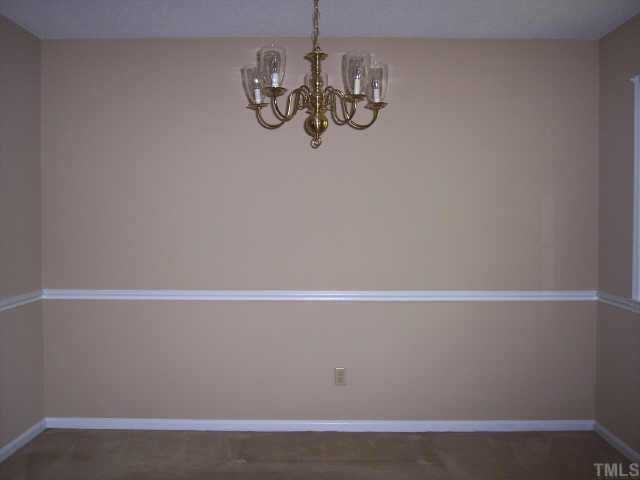 1605 Baker Road Raleigh, NC 27607 - Photo 3 of 7 a view of room with window and wooden floor