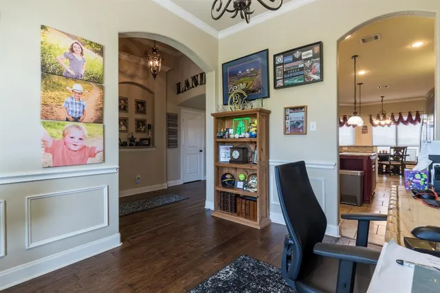 a view of a workspace with furniture and toys
