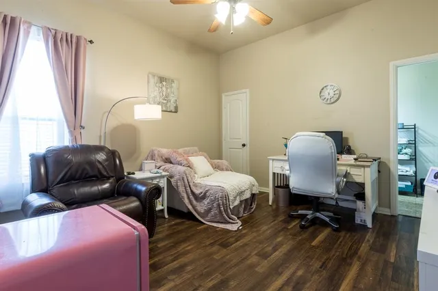 a bedroom with bed and a window