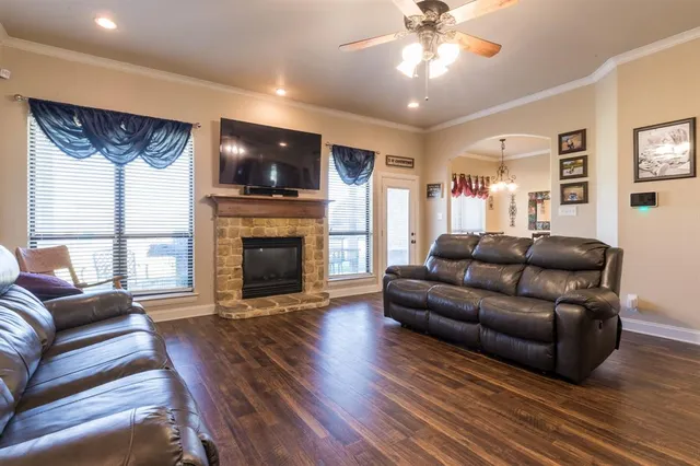 a living room with furniture and a fireplace