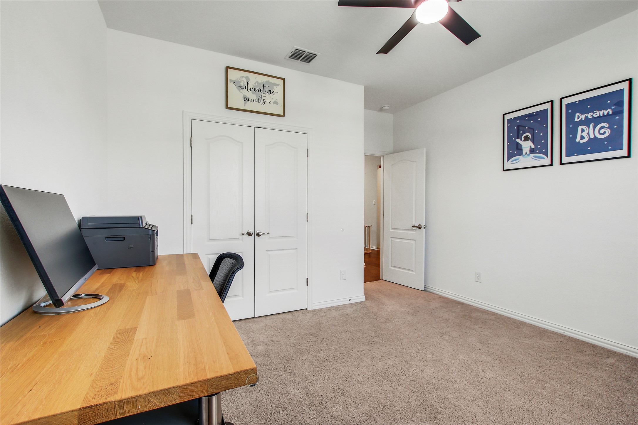 104 Millbend Road Georgetown, TX 78633 - Photo 5 of 40 A well-lit flexible space featuring a ceiling fan and plush carpeting.
