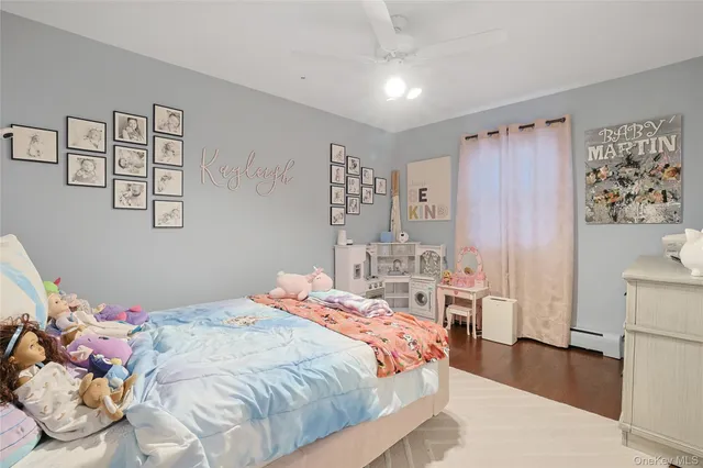 a bathroom with a sink mirror and toilet