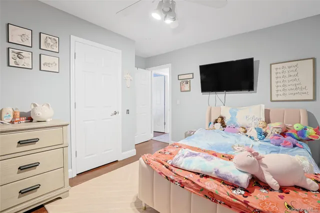 a bedroom with a bed and a table in it