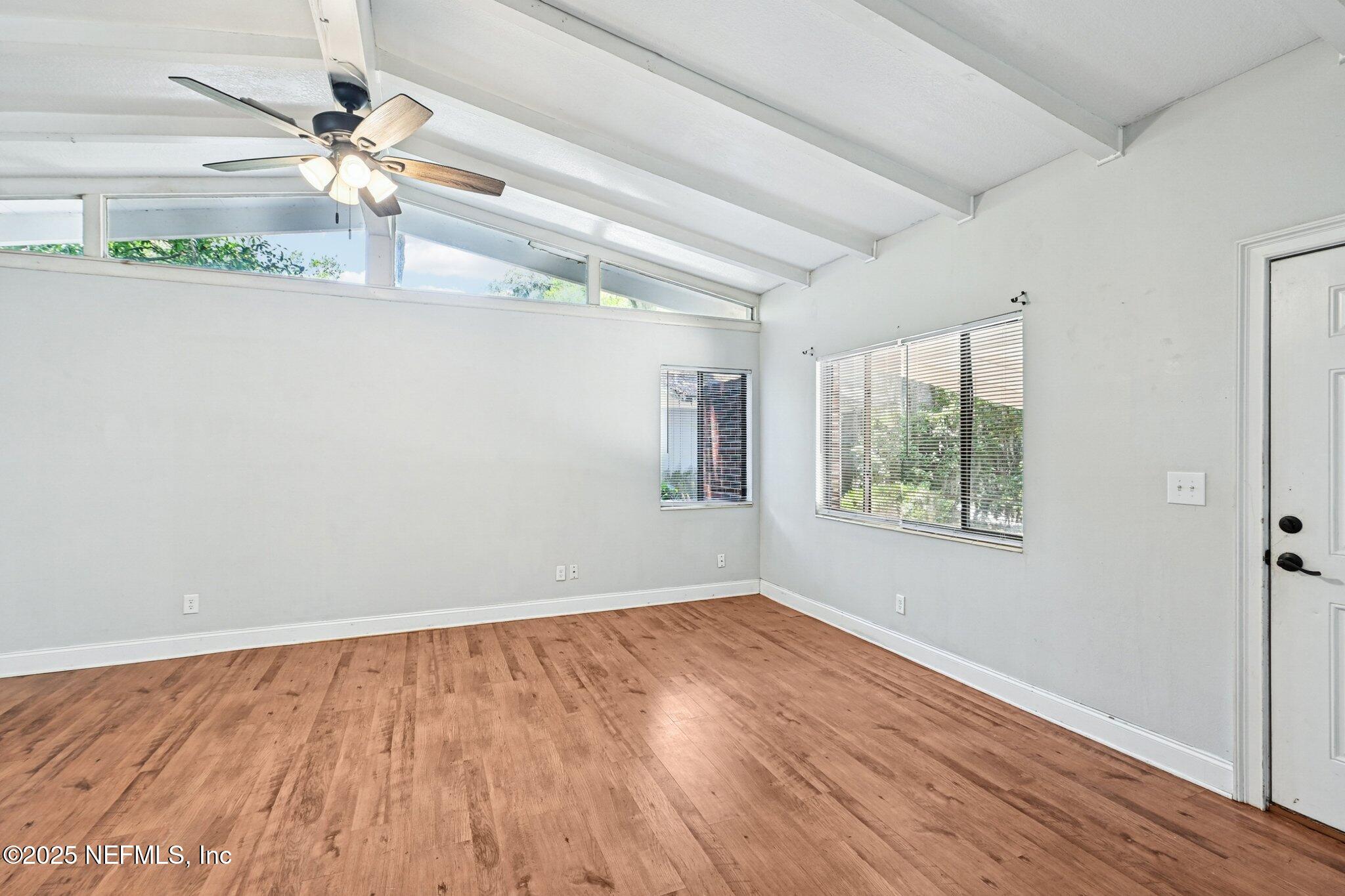 4619 Morris Road Jacksonville, FL 32225 - Photo 11 of 56 a view of a room with wooden floor and fan