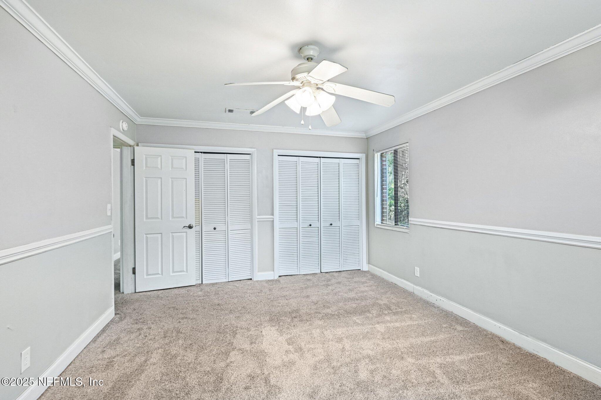 4619 Morris Road Jacksonville, FL 32225 - Photo 23 of 56 a view of an empty room and chandelier fan