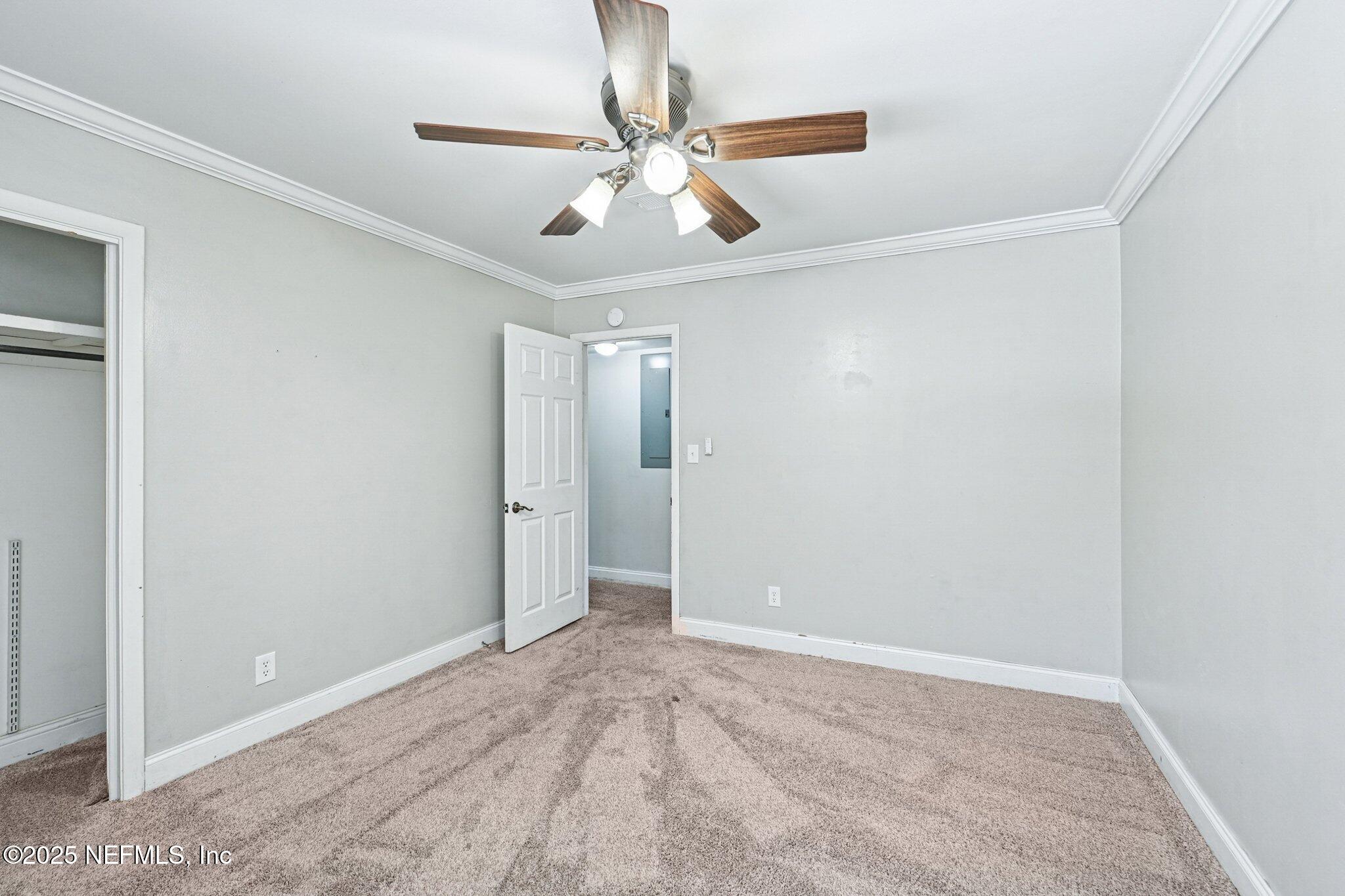 4619 Morris Road Jacksonville, FL 32225 - Photo 26 of 56 a view of an empty room with a ceiling fan