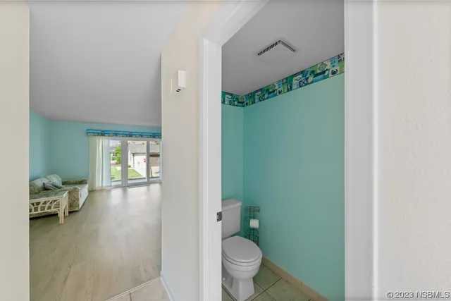 a view of a hallway with staircase